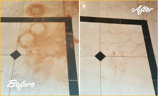 Before and After Picture of a Troy Hard Surface Restoration Service on a Marble Floor to Eliminate Rust Stains